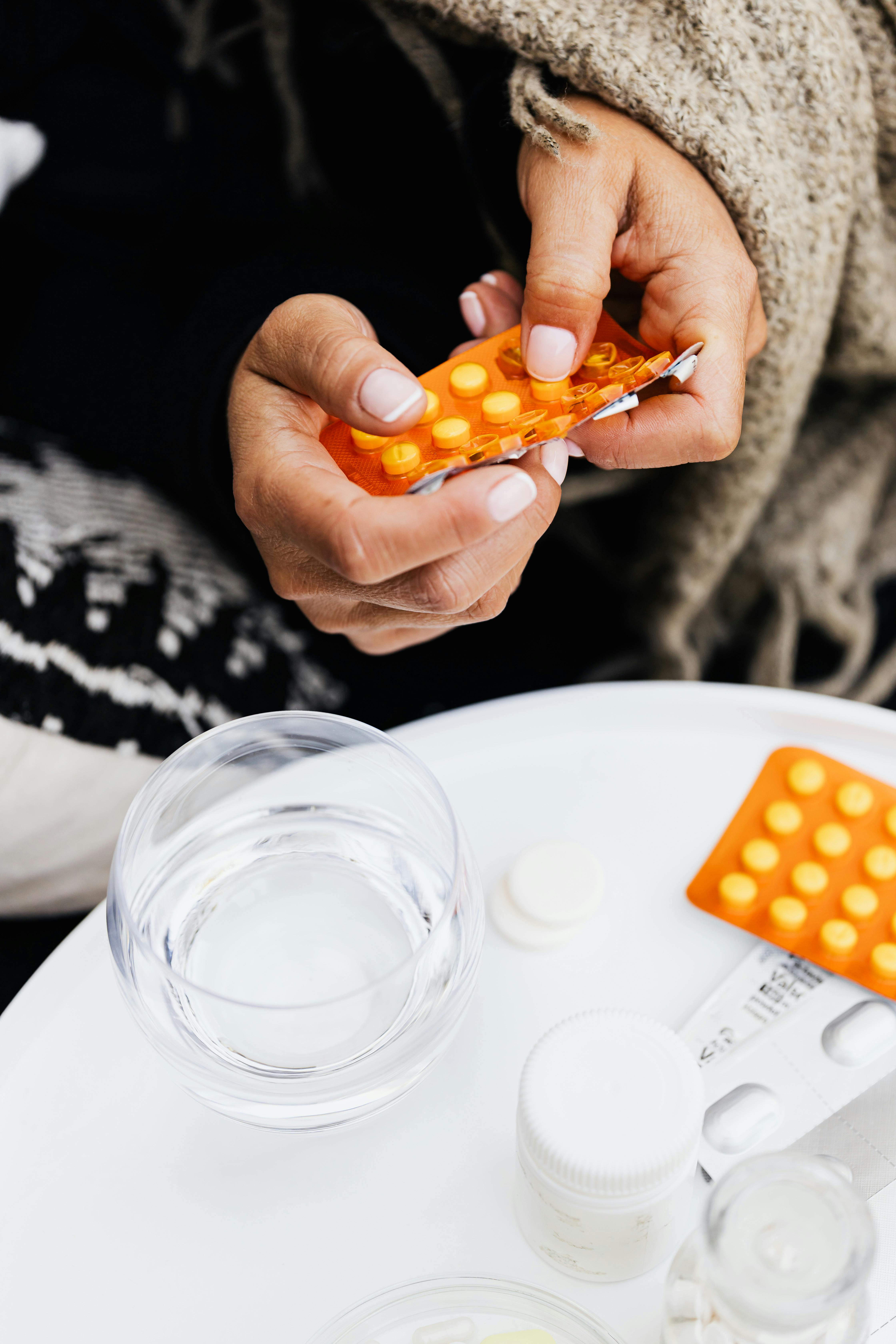 Hand holding a blister pack of pills